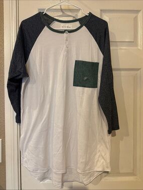 on the byas White Henley with Dark Gray Raglan Sleeves and Green Pocket